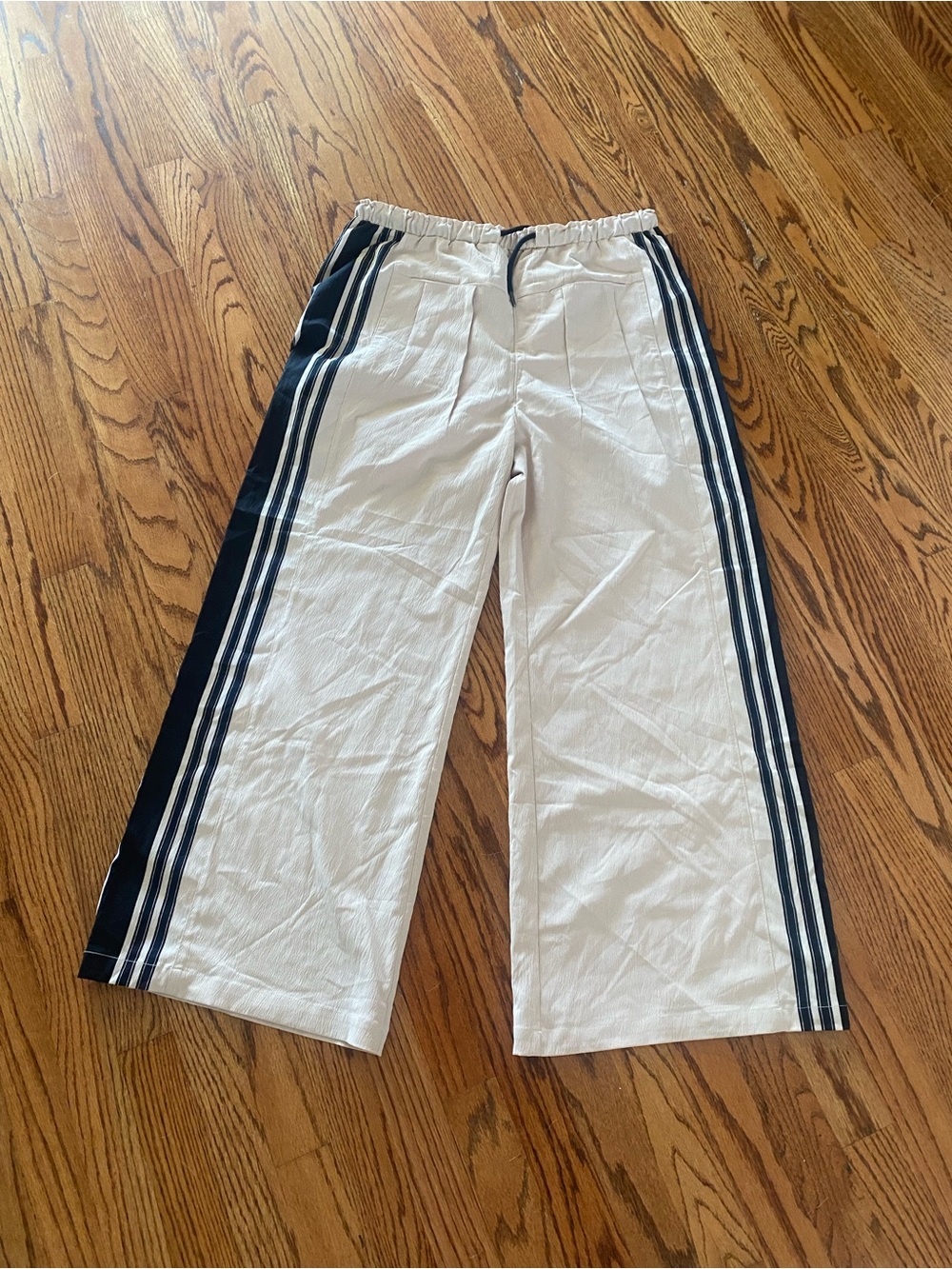 Tan Wide-Leg Track Pants with black Side Stripes